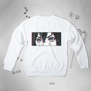 Pode incluir: Camisola branca com uma estampa gr&aacute;fica de olhos de mulher com um efeito de glitch.