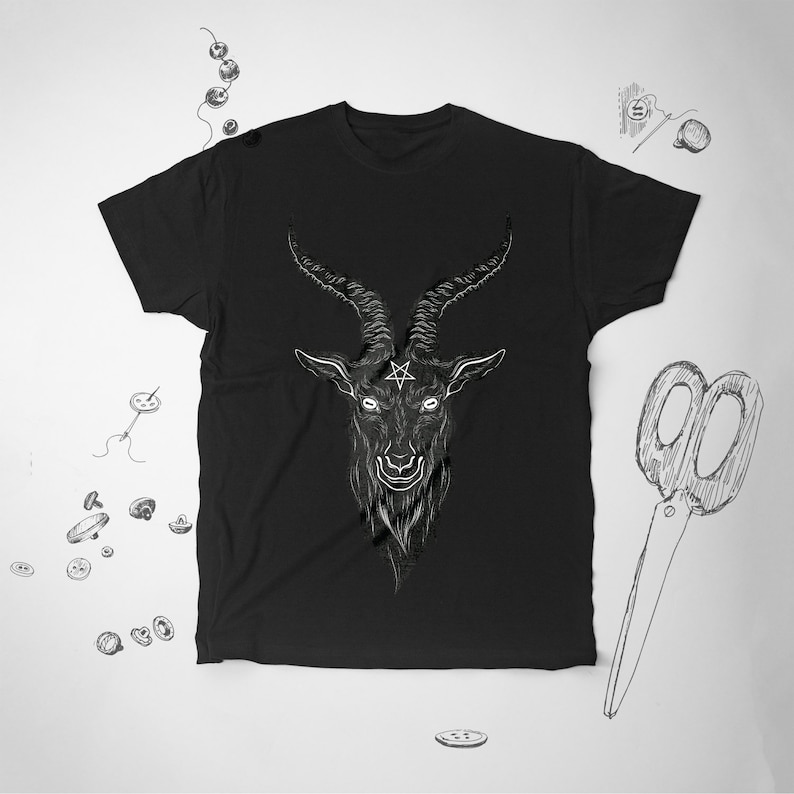 May include: Black t-shirt with a white graphic of a goat's head with horns and a pentagram on its forehead.