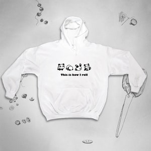 May include: White hooded sweatshirt with a black graphic of four pandas rolling, with the text "This is how I roll".
