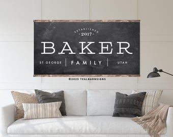 May include: A framed chalkboard-style sign with the name "BAKER" in large white letters. Below, it reads "ST GEORGE | FAMILY | UTAH" and "ESTABLISHED 2017". The frame is a light brown color.
