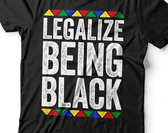 May include: Black t-shirt with the text "Legalize Being Black" in white with a distressed effect. The text is surrounded by a row of colorful triangles.