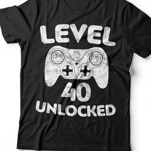 May include: Black t-shirt with a white graphic of a video game controller and the text "LEVEL 40 UNLOCKED".