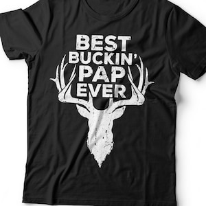 May include: Black t-shirt with a white deer silhouette and the text "BEST BUCKIN' PAP EVER".