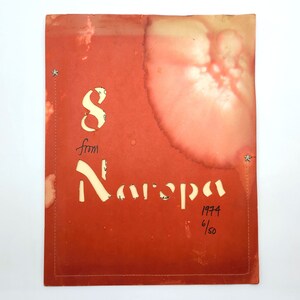 May include: A red paper with a white stencil of the word "from" and the word "Naispa" in a cursive font. The paper has a light brown stain in the center. The number "1974" and the fraction "6/50" are written in black ink in the bottom right corner.