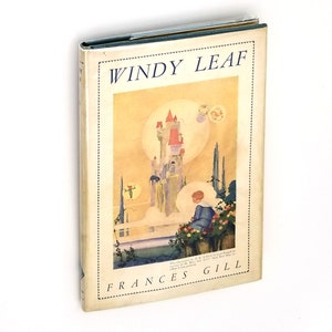 May include: A vintage book cover with the title "WINDY LEAF" in bold, black letters. The cover features a colorful illustration of a castle in the clouds with a child looking out at the scene. The author's name, "FRANCES GILL", is printed in black at the bottom of the cover.