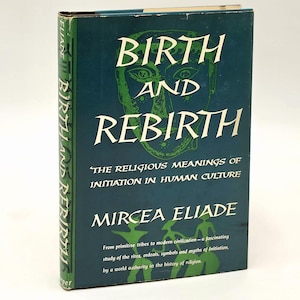 May include: A hardcover book titled "Birth and Rebirth" by Mircea Eliade. The cover is teal with white text and a green face graphic. The book explores the religious meanings of initiation in human culture.