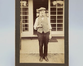 Antique photo of Englishman in 1917 holding tobacco pipe, wearing cap & vest/waistcoat with pocket watch chain