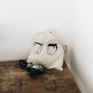 Faces Tote Bag