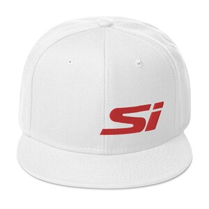 May include: A white baseball cap with a flat brim. The cap features the red letters "SI" embroidered on the front. The hat is made of a durable fabric and has a structured fit.