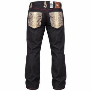 May include: Dark charcoal denim jeans featuring back pockets with a snakeskin pattern, red contrast stitching, and a brown leather patch on the waistband with the letters GG. The belt loops also feature snakeskin accents and a metal button.