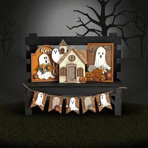 May include: A Halloween-themed wooden bench with decorative elements. It features a house, ghosts, pumpkins, and a banner with ghost cutouts. The word "hey" is visible on a sign. The background is a dark, spooky scene.
