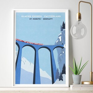 May include: A vintage-style poster with a blue and white illustration of a red train traveling over a bridge with three arches. The poster has the text "Glacier Express Switzerland St Moritz - Zermatt" at the top.