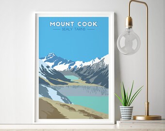 May include: A vintage-style poster with a blue sky and white clouds. The poster features a mountain range with snow-capped peaks and a turquoise lake in the foreground. The text "MOUNT COOK - SEALY TARNS" is printed in white at the top of the poster.
