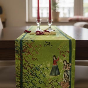 May include: A green table runner with a dark green border and illustrations of women in traditional clothing. The runner has calligraphy and red accents. Two red candles in glass holders sit on the runner.