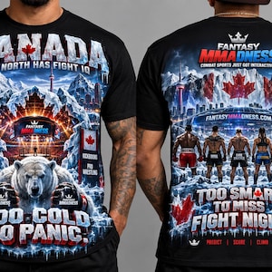 May include: A black t-shirt featuring a graphic print of a polar bear wearing boxing gloves, a snowy mountain landscape, and the text "CANADA THE NORTH HAS FIGHT IQ" and "TOO COLD TO PANIC" on the front, with "FANTASY MMADNESS" on the back.