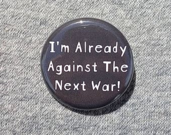 I'm already against the next war - Button - Magnet - Bottle Opener