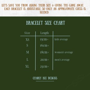 May include: A bracelet size chart with a dark green background. The chart includes sizes XS to XL, with corresponding lengths in centimeters. Text at the top reads, "LET'S SAVE YOU FROM ASKING THEIR SIZE & GIVING THE GAME AWAY..." and "CHARLY BEE DESIGNS" at the bottom.