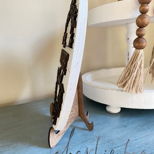 This sign is made from 1/2 inch Blondewood. The 10.5" sign comes with a stand as pictured here.