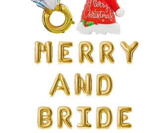 May include: Gold foil letter balloons spelling "Merry and Bride" with a gold ring balloon and a red Santa hat balloon.