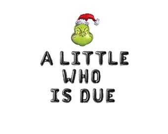May include: A green Grinch character wearing a Santa hat with the text "A little who is due" in black letters.