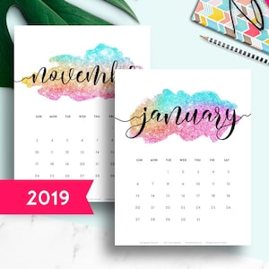 May include: Printable calendar for 2019, featuring a rainbow glitter design with the months of November and January highlighted. The calendar includes the months of January through December and is available in US Letter, A3, and A5 sizes.
