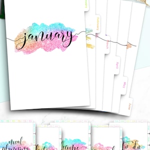 May include: Twelve colorful monthly dividers and six organizer tabs with glitter accents. The dividers are labeled January through June. The organizer tabs are labeled "meal planning", "lists", "home", "journal", and "to do".