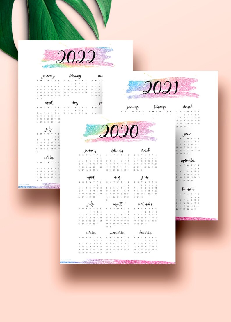 May include: Three printable calendars for the years 2020, 2021, and 2022. Each calendar features a colorful watercolor design with a rainbow gradient.