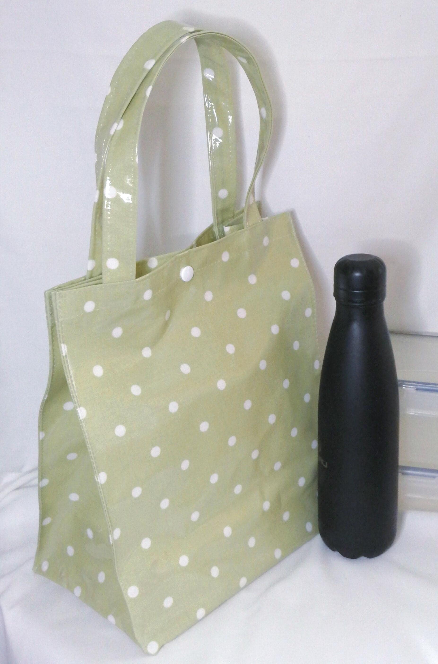 A Lunch Tote 100% Cotton Oilcloth with snap fastener - Sage Green Spot