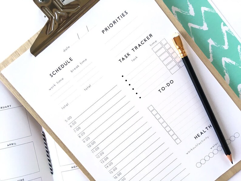 May include: A white printable planner with sections for scheduling, task tracking, to-do lists, and health goals. The planner has a simple design with black text and bullet points.