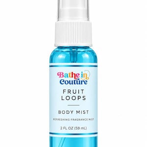 May include: A clear plastic spray bottle filled with bright blue liquid. The label features the text Bathe in Couture, FRUIT LOOPS, BODY MIST, REFRESHING FRAGRANCE MIST, and 2 FL OZ (59 mL). It has a white pump and a clear cap.