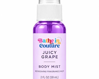 May include: A clear plastic spray bottle filled with purple liquid body mist. The label reads Bathe in Couture, Juicy Grape, Body Mist, Refreshing Fragrance Mist, and 2 fl oz (59 mL). It has a white pump nozzle and a clear plastic cap.
