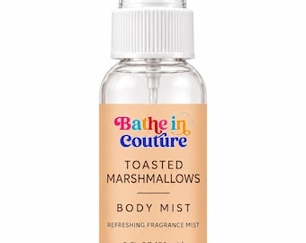 May include: A clear plastic spray bottle containing body mist with a white cap. The label is light orange and features the text Bathe in Couture, TOASTED MARSHMALLOWS, BODY MIST, REFRESHING FRAGRANCE MIST, and 2 FL OZ (59 mL) in black and colorful font.