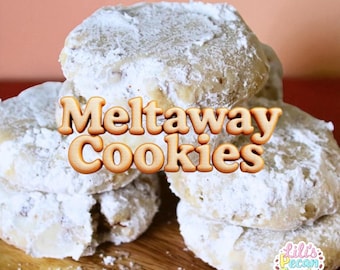 May include: A stack of melt-away cookies dusted with powdered sugar. The cookies are light brown with visible pecan pieces. The image includes the text "Meltaway Cookies" and a logo that says "Lili's Pecan Treats & More".