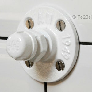 May include: White porcelain pipe fitting with a round flange and four screws. The flange has the text "1/2" and "121" printed on it.