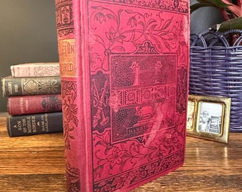 Libro antiguo de tapa dura titulado "Cómo triunfar en el mundo", publicado por Worthington Co. en 1890.