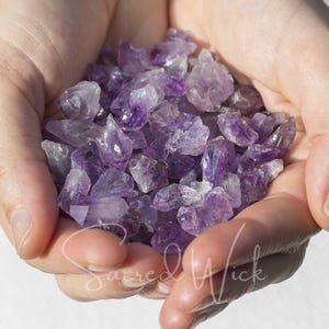 May include: A handful of small, purple amethyst crystals.