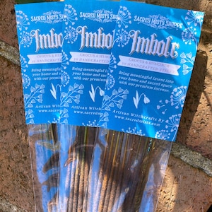 May include: Three packages of incense sticks labeled "Imbolc" with the text "Crocus & Hyacinth 10 Handcrafted Sticks" and "Artisan Witchcrafts By www.sacredmists.com".
