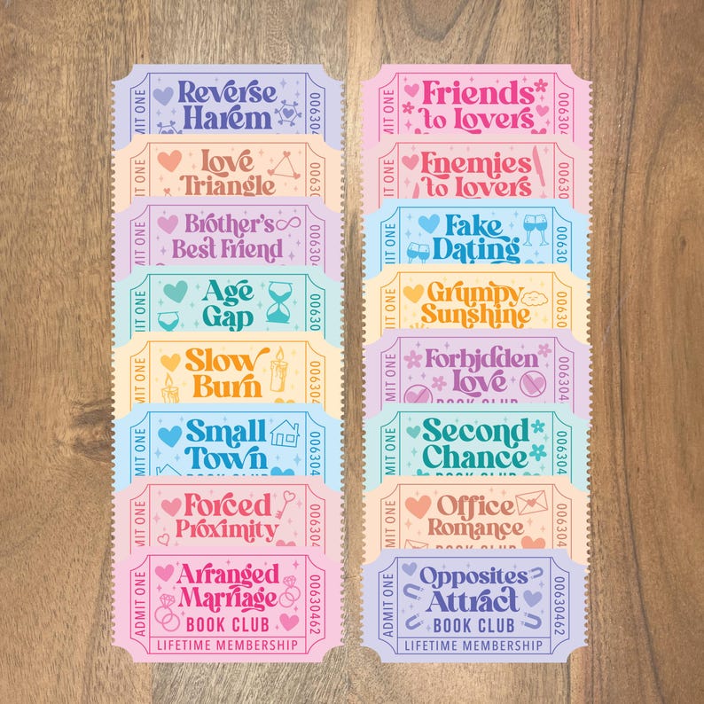 May include: A collection of colorful ticket-style cards with various romance novel themes, including "Reverse Harem," "Friends to Lovers," and "Arranged Marriage." Each card features decorative elements and the text "BOOK CLUB" and "LIFETIME MEMBERSHIP."