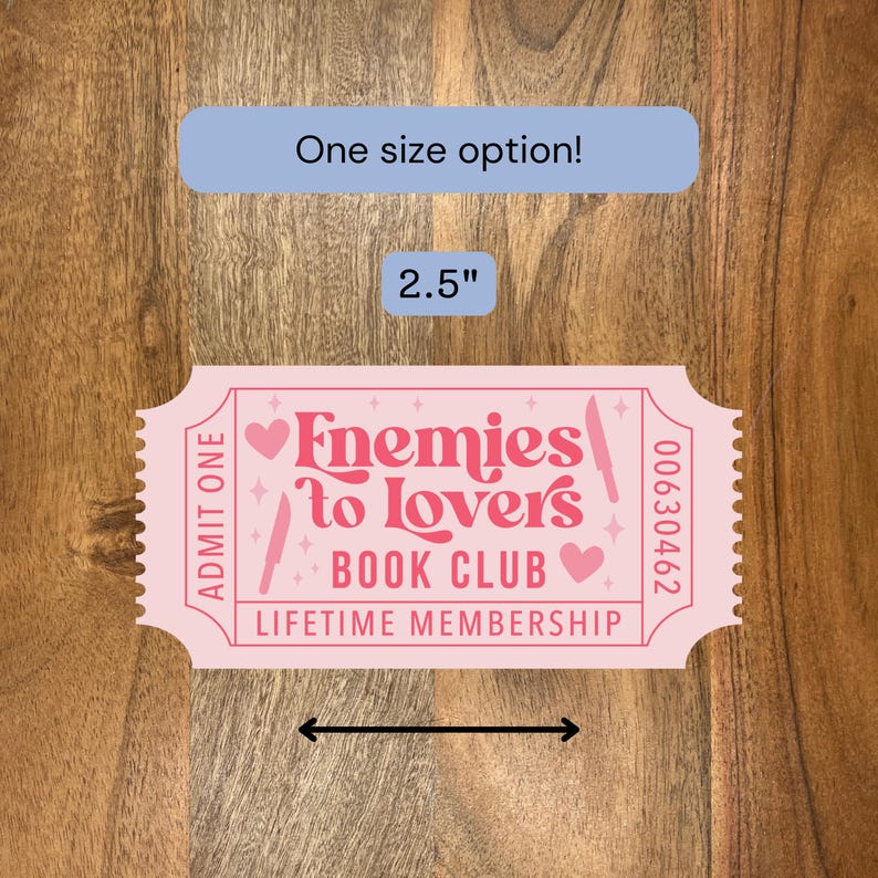 May include: A pink ticket-shaped sticker with the text "Enemies to Lovers Book Club Lifetime Membership." The sticker is 2.5 inches wide and has a blue rectangle that says "One size option!"