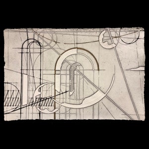 Puede incluir: Impresión de arte abstracto con fondo blanco y líneas negras y marrones. La impresión presenta un círculo blanco grande con un círculo más pequeño en su interior. La impresión está enmarcada en un marco negro.