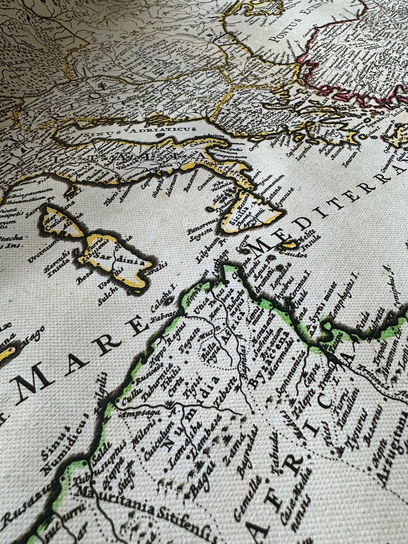 Historical map showing the Roman Empire and surrounding barbarian tribes in 400 AD, by cartographer Guillaume Delisle.