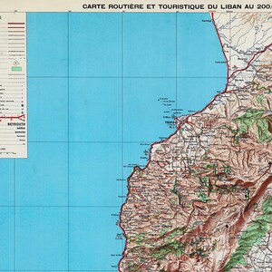 A vintage road and tourist map of Lebanon, showing geographical details and transportation routes.
The map shows the cities of Beirut, Tripoli, and Saida.