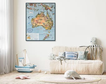 May include: A framed vintage map of Australia, featuring detailed illustrations of landmarks and wildlife. The map is in a colorful, illustrative style, with a blue background and a dark frame. The map includes the text "Australia".