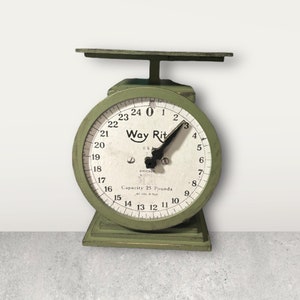 May include: Green vintage scale with a white face and black hands. The face reads "Way Rit" and "Capacity 25 Pounds".
