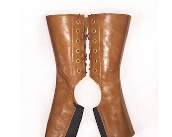 May include: A pair of brown leather boot gaiters with a lace-up back and elastic at the bottom.
