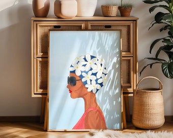 May include: A framed illustration of a woman with a blue and white floral head covering and sunglasses. The woman is wearing a red top and is looking to the right. The background is a light blue with shadows.