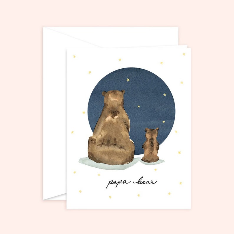 May include: A watercolor illustration of two brown bears sitting back to back, looking up at a blue circle with white stars. The text "papa bear" is written below the bears.