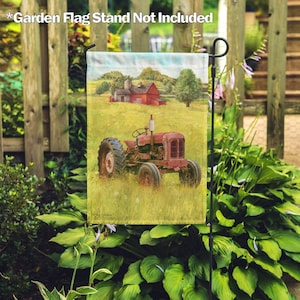 May include: A red and white farmhouse with a red tractor in a field of green grass. The scene is depicted on a garden flag.