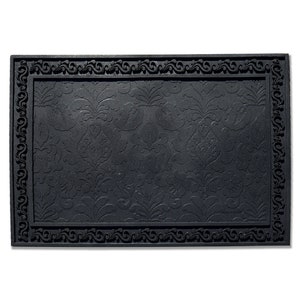 May include: Black doormat with a decorative, ornate border and a patterned design. The design features a repeating floral motif.