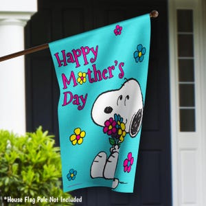 May include: A blue and white garden flag with a cartoon Snoopy holding a bouquet of flowers. The flag reads "Happy Mother's Day".